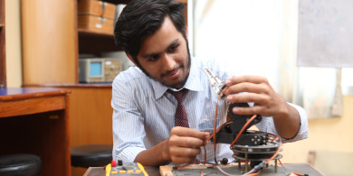 Creative student creating technical tools at lab