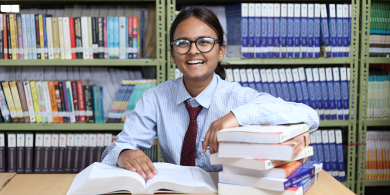 BBM Student in library around lot of books