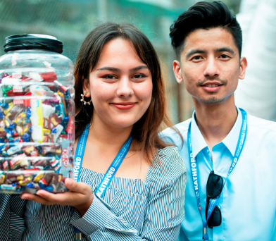 Friends sharing a moment with a jar of chocolate