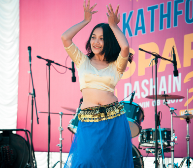 Student performing dance on stage as part of Kathford Sparks festival festivities