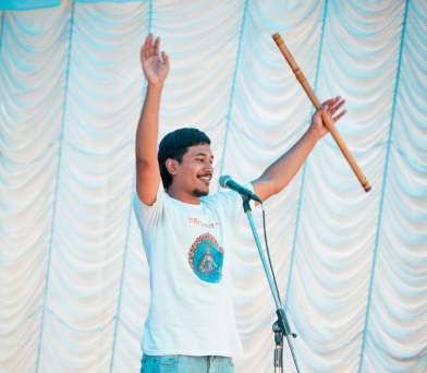 Student playing flute on stage as part of Kathford Sparks festival festivities