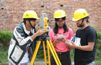 A civil engineering student operating a Total Station