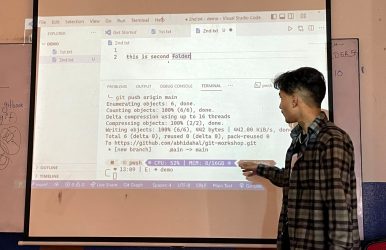 Instructor teaching Git commands and repository management to students