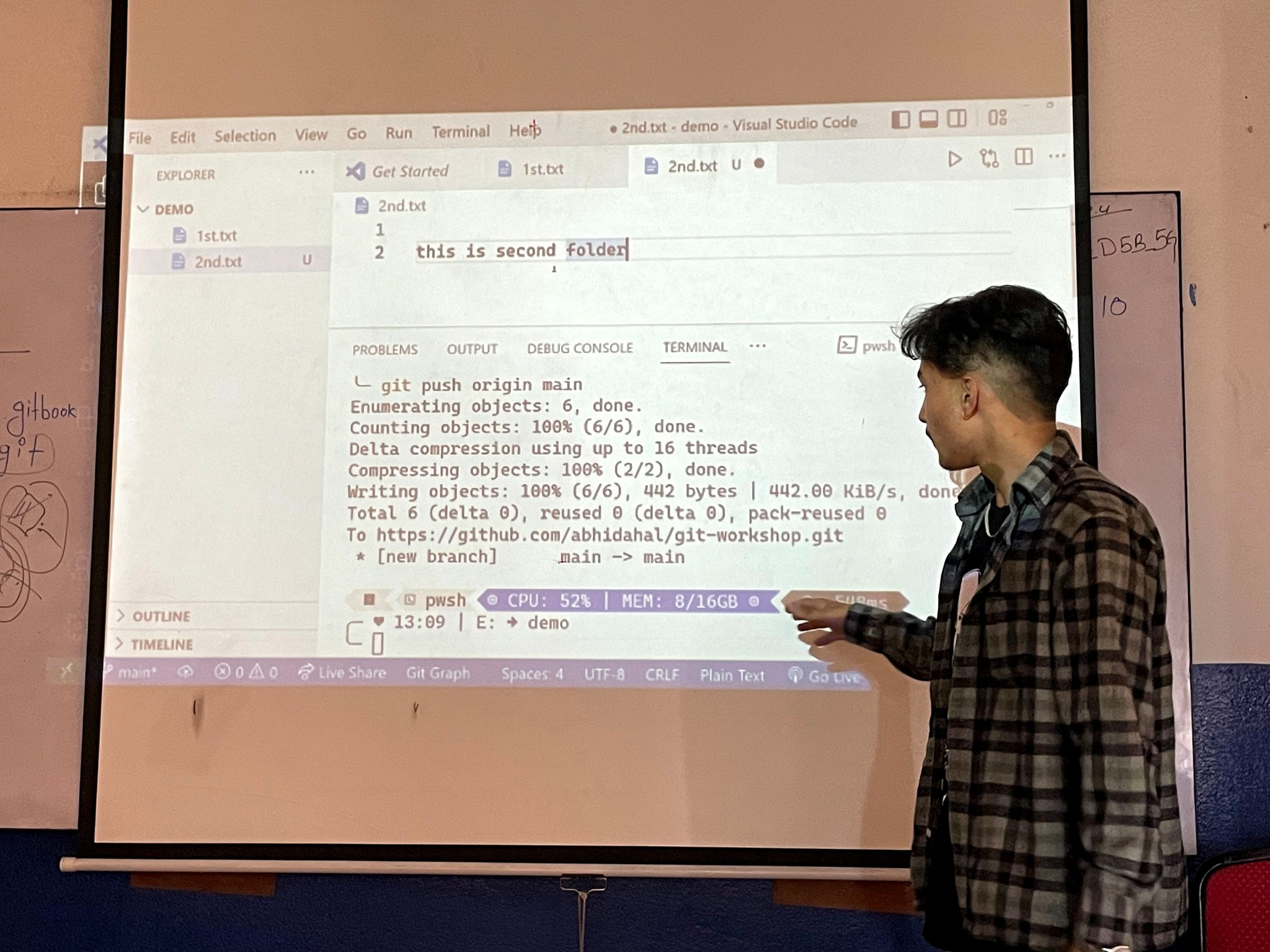 Instructor teaching Git commands and repository management to students