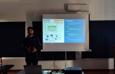 Speaker explaining data pipelines, storage solutions, and processing frameworks