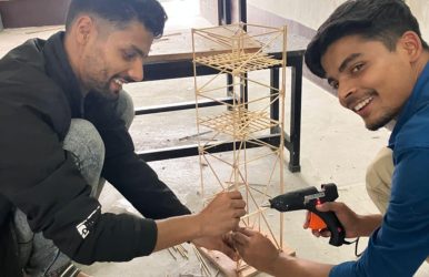 Students constructing models for shake table
