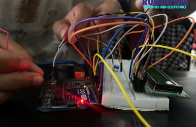 Students learning Arduino components and basic coding techniques.