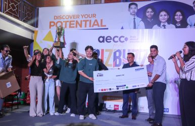 BizBuzz event winner holding grand cash price along with trophy