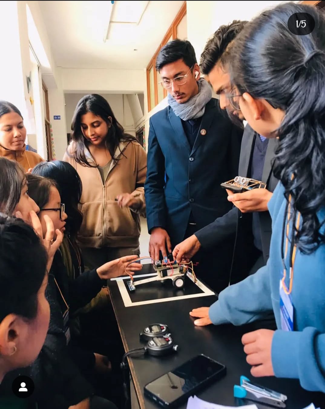 Students actively engaging in a workshop related to robotics