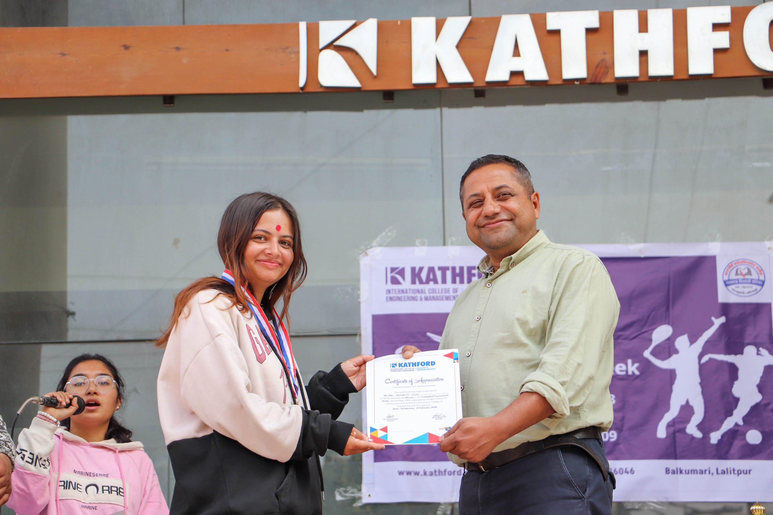 Student receiving a certificate during Engineering Sport Week at Kathford.