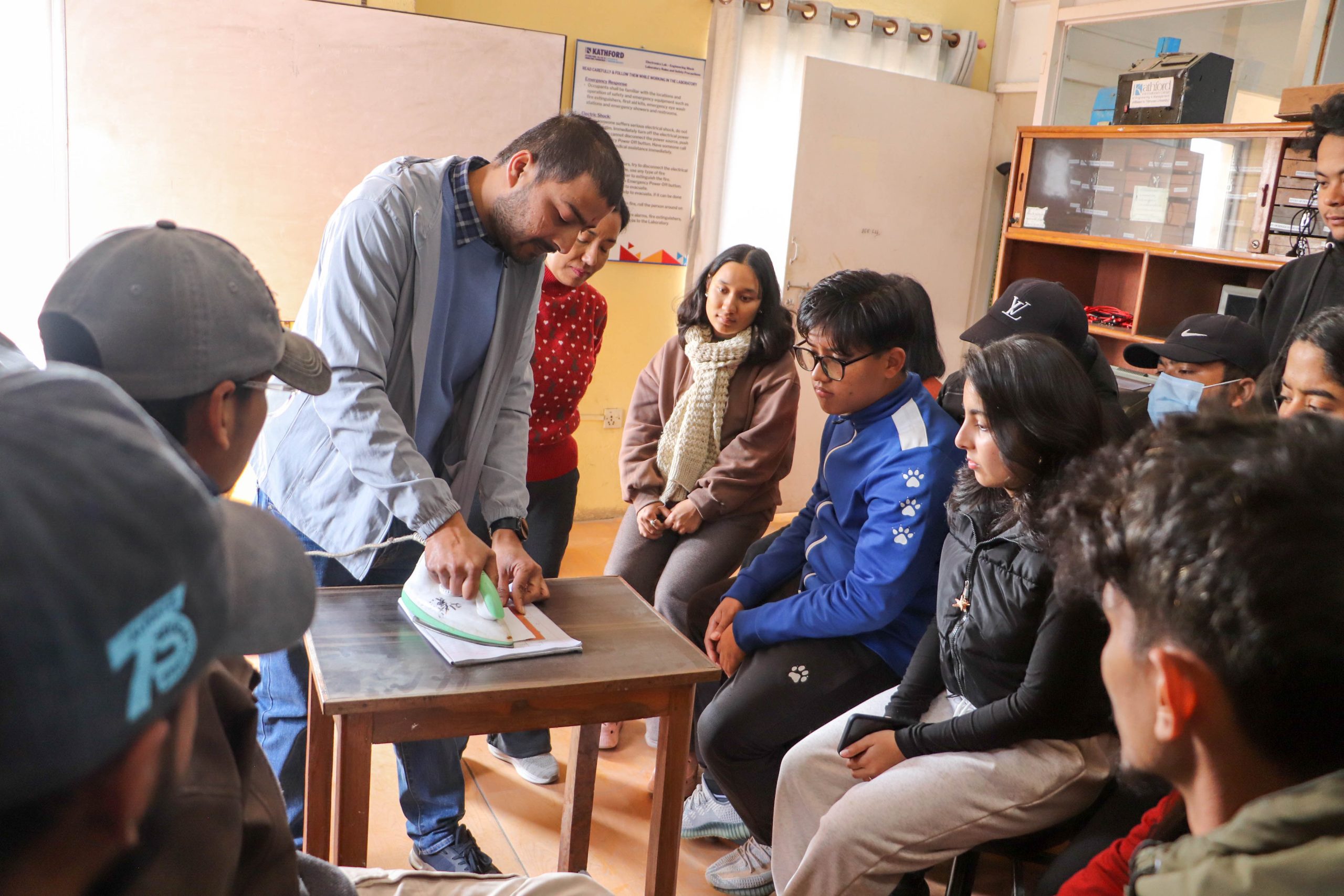 Instructor demonstrating PCB fabrication to students during the workshop.