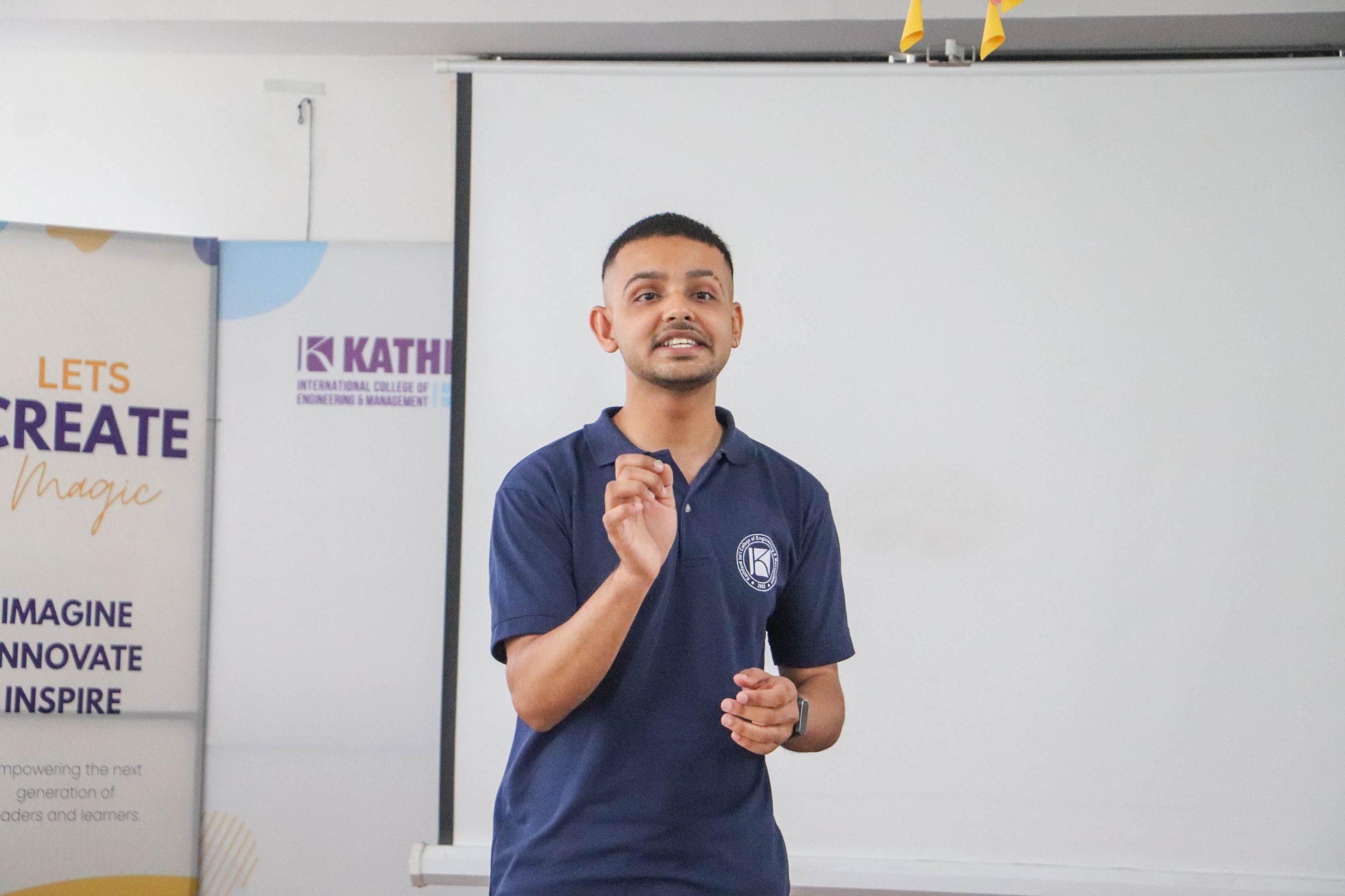 Student speaking confidently during a presentation at KathTalk event